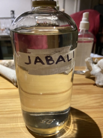 Mezcal in glass bottle with handwritten label